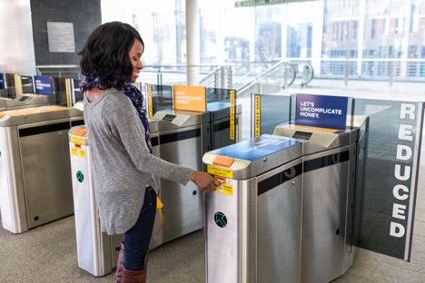 Customer scanning into a fare gate